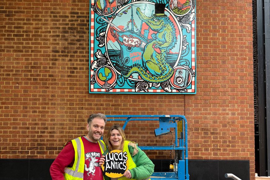 Lucas Antics and the mural in Cabot Cicus 